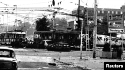 Burned trams and cars in the center of Sarajevo after heavy shelling by Bosnian Serb forces in May1995