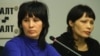 Bakiya Kasymova (left) and Leila Ashirova, both recently freed from captivity, talk to reporters in connection with a recent "slavery" scandal involving migrant workers in Moscow.