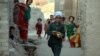 An Afghan youth carries bread for Iftar, the meal for breaking the fast during the Muslim holy month of Ramadan on the outskirts of Jalalabad.