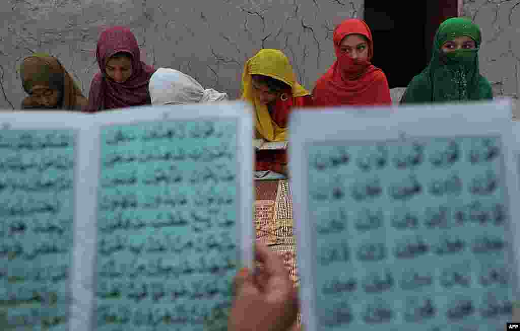 Children read the Koran at a mosque on the outskirt of Jalalabad, Afghanistan. (AFP/Noorullah Shirzada)