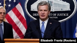 FBI Director Christopher Wray said, "Russian government-directed foreign malign influence campaigns" operate at Moscow's direction, setting up websites "filled with Russian government propaganda" meant to deceive American users. (file photo)