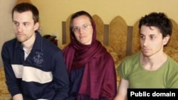 Detained U.S. citizens Shane Bauer (left), Sarah Shourd, and Josh Fattal (right) wait to meet with their mothers at a hotel in northern Tehran on May 20.