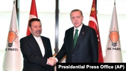 President of Turkey Recep Tayyip Erdogan (R) meets with Mahmoud Vaezi, special envoy of Iranian President, at his ruling party headquarters in Ankara, May 16, 2018
