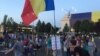 Scores of protesters show up on August 14 outside the government building in Bucharest, calling for the resignation of Prime Minister Viorica Dancila's cabinet.