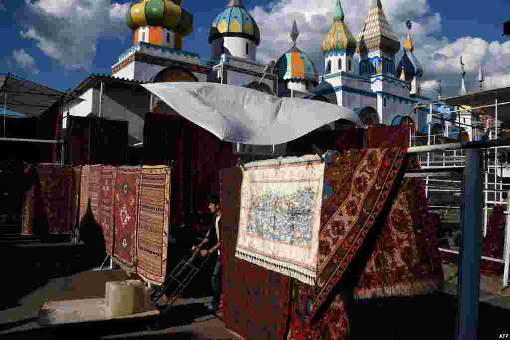 A worker pushes a hand trolley in a market in the local kremlin in the Izmaylovo district in the suburbs of Moscow. (AFP/Vasily Maksimov)