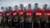 Turkish soldiers serving in the NATO-led Kosovo peacekeeping force, KFOR, hold a line with shields during a crowd-and-riot-control exercise near the town of Ferizaj. (AFP/Armend Nimani)