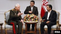 Azerbaijan Defense Minister General Safar Abiyev (left) appears with Iranian President Mahmud Ahmadinejad (right) in Tehran on March 13.