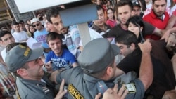 Armenia - Riot police confront youth activists protesting against higher bus fares in Yerevan, 22Jul2013.