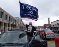 People protest against the coronavirus lockdown in Lansing in the U.S. state of MIchigan.