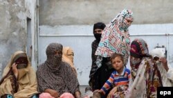FILE: Mothers whose children were sexually abused by a gang gather at a house in the village of Hussain Khanwala in Kasur district of the eastern province of Punjab.