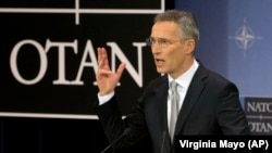 NATO Secretary-General Jens Stoltenberg speaks at NATO headquarters in Brussels on February 15.