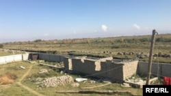 A building under construction adjacent to no-man’s land, near Khayom village, in Tajikistan's Farkhor district.