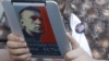 An opposition activist uses an electronic device with a portrait of prominent anticorruption blogger Aleksei Navalny during a protest in central Moscow last week.