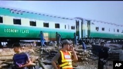 The engine of the Akbar Express appeared to be destroyed and at least three carriages were derailed in the collision.