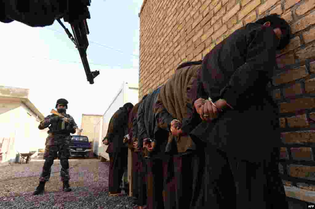 Captured Taliban insurgents are presented to the media in Herat, Afghanistan, on January 15. (AFP/Aref Karimi)