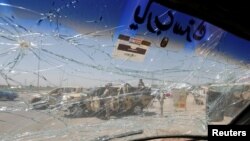 Ираксткий военный автомобиль, задетый взрывом продуктовом рынке Эр-Рашидия во вторник