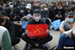 Imagine de la proteste din Hong Kong față de torturarea uigurilor de către China