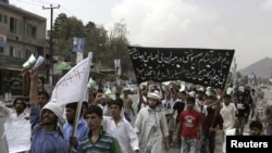 Several hundred Afghans chanting "Death to America" rallied outside a mosque in the Afghan capital on September 6 to protest plans by a small U.S. church to burn copies of the Koran.