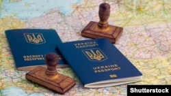 Ukraine -- Ukrainian foreign passports, stamps and map of Europe, Kyiv, 2016