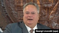 MACEDONIA -- Greek Foreign Minister Nikos Kotzias (L) gestures next to his Macedonia counterpart Nikola Dimitrov at the Ministry of Foreign Affairs in Skopje, August 31, 2017