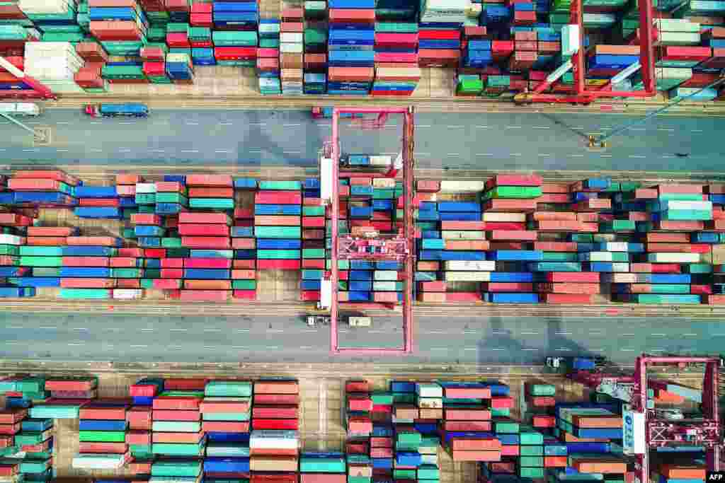 An aerial photo shows containers stacked at a port in Qingdao in China&#39;s eastern Shandong Province. (AFP/Stringer)