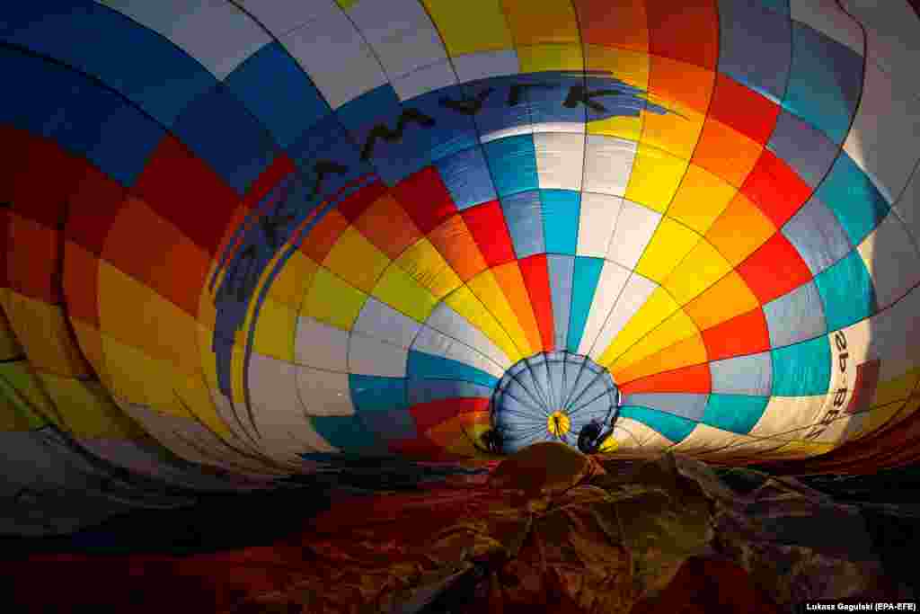 A hot-air balloon is prepared for the start of a race as part of celebrations to mark the 100th birthday of the late Pope John Paul II in Krakow. (epa-EFE/Lukasz Gagulski)