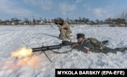 Militari poloni și ucraineni reproduc o bătălie intro forțele lor din 1919.