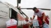 Iranian Red Crescent volunteers receive aid to be distributed to people in Ahvaz, the capital of the southwestern Iranian province of Khuzestan, on April 9. 