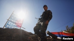 A KFOR soldier from France walks along barricades at the closed Serbia-Kosovo border crossing of Brnjak on October 19.