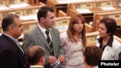 Armenia -- Opposition leader Raffi Hovannisian (L) and lawmakers from his Zharangutyun (Heritage) party speak in parliament, undated.