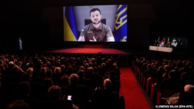 Volodymyr Zelensky appears on a screen during the opening ceremony of the 75th annual Cannes Film Festival in Cannes, France, on May 17.