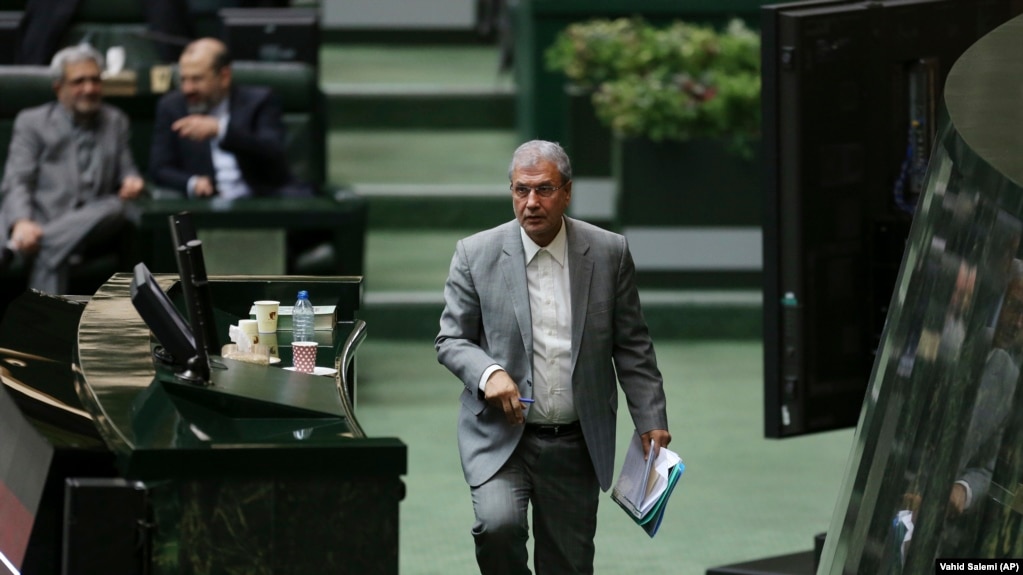Iranian Labor Minister Ali Rabiei walks to the podium during his parliament impeachment hearing, in Tehran, March 13, 2018