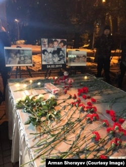 A makeshift memorial in Astana to the five sisters