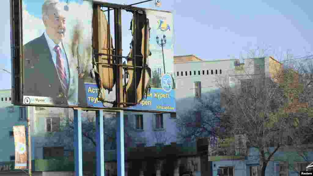 A billboard of Kazakh President Nursultan Nazarbaev shows damage following recent riots in the town of Zhanaozen. (Reuters/Vladimir Tretyakov)