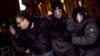 Полиция задерживает одного из участников акции на Триумфальной площади. 6 декабря 2011 года