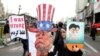 An Iranian woman holds an effigy of U.S. president Donald Trump, during a rally marking the 40th anniversary of the 1979 Islamic Revolution, in Tehran, February 11, 2019