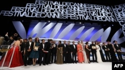 Winners and hosts onstage at the conclusion of the 66th Cannes International Film Festival in May.