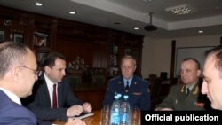 Armenia - Defense Minister Seyran Ohanian (L) meets with Major-General Vladimir Ustinov (second from right), the new commander of the Russian military base in Armenia, Yerevan, 20Apr2015.