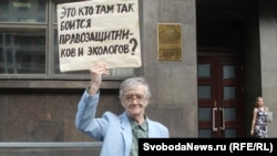 A supporter of the opposition Yabloko party protests against the NGO bill in front of the State Duma in Moscow on July 6. His sign reads, "Who is it in there who's so afraid of rights activists and ecologists?"