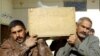 Men carry the coffin of a bomb attack victim during a funeral in Al-Najaf.