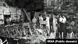 Fire fighters standing inside Rex Cinema in the southern city of Abadan, after the fire that killed hundreds on 19 August 1978.