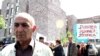 Former school teacher Levon Avagian facing child abuse charges walking away from a protest in Yerevan, 19 May 2010