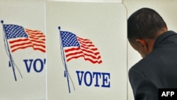 U.S. -- A voter casts his ballot during the midterm elections in Centreville, Virginia, 02Nov2010