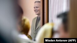 Jehovah's Witnesses face persecution in Russia. Here, Dennis Christensen, a Danish member of the religious group, awaits the verdict of his case in the town of Oryol, western Russia, in 2019.