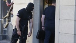 Armenia - An armed officer of the National Security Service guards an entrance to the Yerevan house of former President Serzh Sarkisian's brother Aleksandr searched by investigators, 4 July 2018.