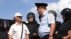 "Шел с российским флагом". Как отбывали наказание задержанные 9 сентября
