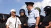 "Шел с российским флагом". Как отбывали наказание задержанные 9 сентября