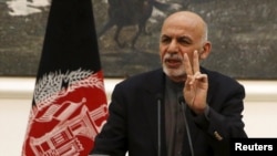 President Ashraf Ghani says Afghan forces will observe a cease-fire 'provided that the Taliban participate.' (file photo)