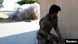 Kurdish fighters in Raqqa