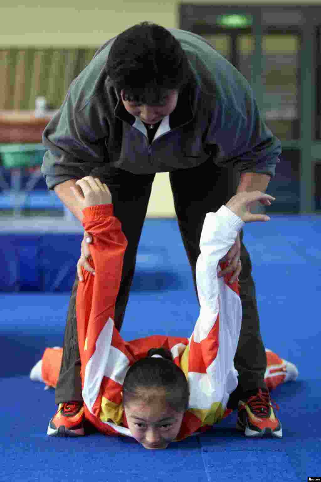 The 2000 Sydney Olympics saw a record-equaling eight medals for China's gymnastics team, until some questions were raised about Dong Fangxiao. An investigation found she had been just 14 while competing -- two years below the minimum age. A Chinese state-controlled newspaper quoted an expert as saying, "Coaches -- and not just in China -- have also long falsified ages for girls whose small and supple bodies give them a competitive advantage over larger and older young women."
